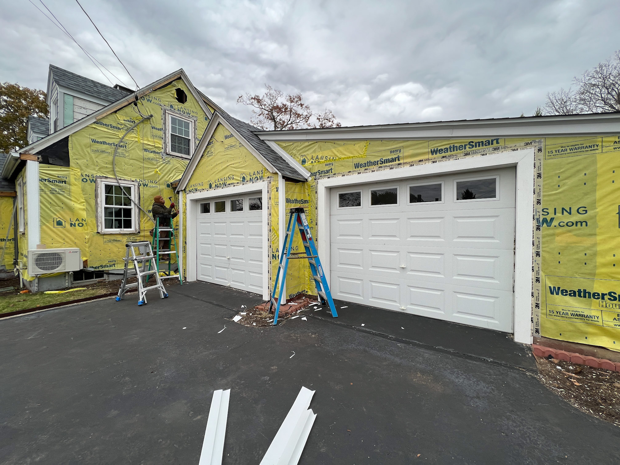 Venture Window applying a weatherproof wrap to a home